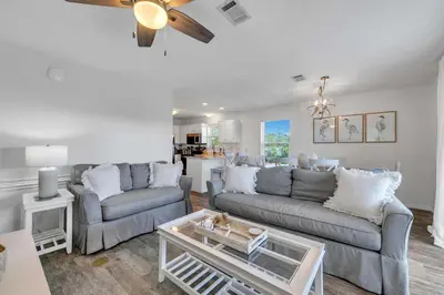 a living room with two couches and a coffee table at Beachside Villas 933 in Santa Rosa Beach