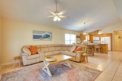 a living room with a couch and a table at Panama City Vacation Rental with 2 Community Pools! in Panama City Beach