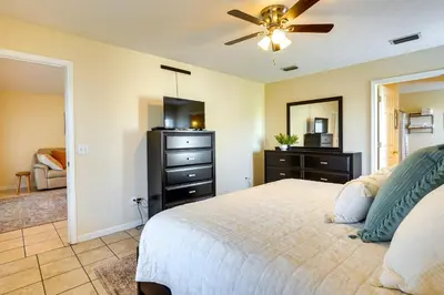 a bedroom with a bed and a ceiling fan at Panama City Vacation Rental with 2 Community Pools! in Panama City Beach