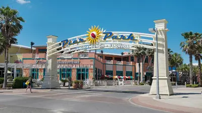a sign for the disney park resort at A Salty Cru in Panama City Beach