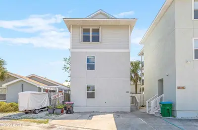 a white house with a tent in front of it at Sea La Vie in Panama City Beach