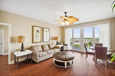 a living room with a couch and a table at Laketown Wharf #1230 by Nautical Properties Vacation Rentals in Panama City Beach