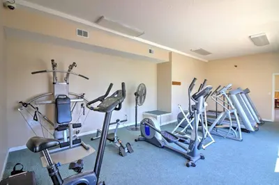 a gym with several exercise bikes in a room at Walk to Beach! PCB Resort Condo with Pool Access in Panama City Beach