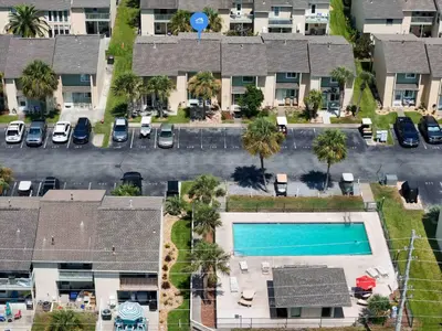 an aerial view of a apartment complex with a swimming pool at Beach access close to Walmart, Bowling,skating and Game room in Panama City Beach