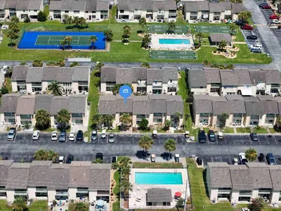 an aerial view of an apartment complex with swimming pools at Beach access close to Walmart, Bowling,skating and Game room in Panama City Beach