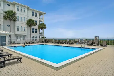 a large swimming pool in front of a building at 30A Villas at Sunset Beach by Panhandle Getaways in Rosemary Beach