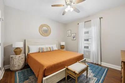 a bedroom with a bed and a ceiling fan at Laketown Wharf #333 by Nautical Properties in Panama City Beach