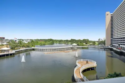 a view of a river with a bridge and buildings at Laketown Wharf #333 by Nautical Properties in Panama City Beach