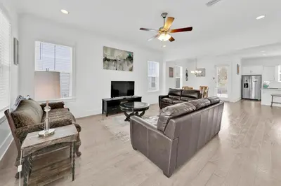 a living room with a couch and a table at Grande Pointe Sea Shell in Inlet Beach