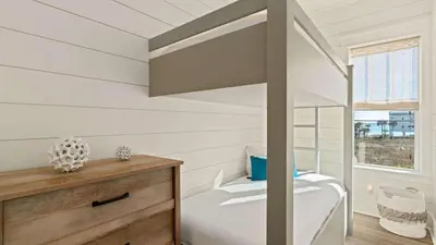 a small bedroom with a bunk bed and a window at 30A Beach Therapy in Inlet Beach