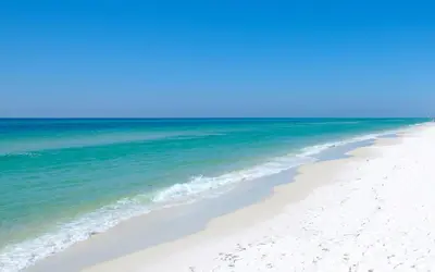 a beach with white sand and blue water at 30A Beach Therapy in Inlet Beach