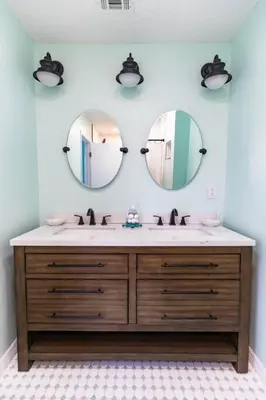 a bathroom with a sink and two mirrors at Spacious Family Hideaway on the Emerald Coast! in Panama City Beach