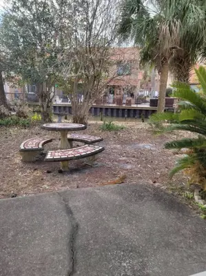 a picnic table and benches in a park at 188WSD in Panama City Beach