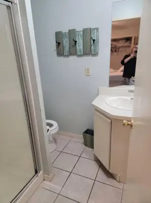 a white bathroom with a sink and a toilet at 188WSD in Panama City Beach