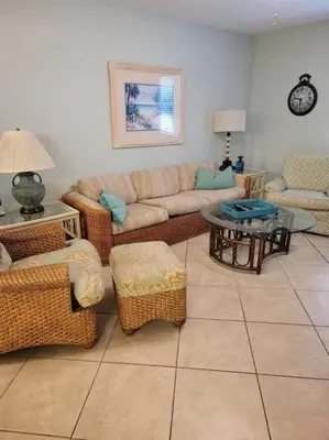 a living room with a couch and a table at 188WSD in Panama City Beach