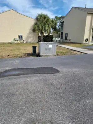 aphalt street with a sign that says distort in front of a building at 188WSD in Panama City Beach