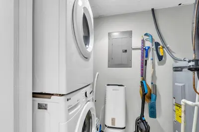 a laundry room with a washing machine in a vehicle at Long Beach Resort 1-904 in Panama City Beach