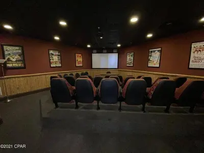 a conference room with chairs and a projection screen at Beautiful Beach Condo - luxury living at its best in Panama City Beach