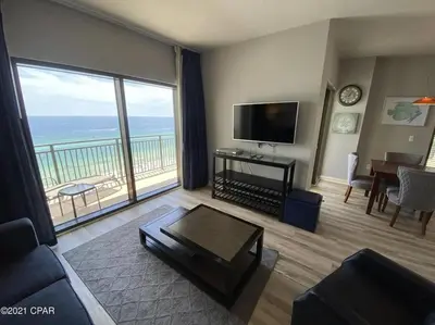 a living room with a view of the ocean at Beautiful Beach Condo - luxury living at its best in Panama City Beach