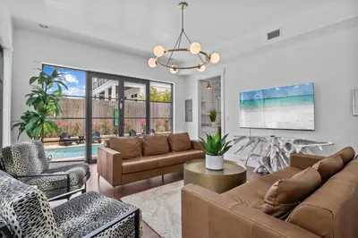 a living room with a couch and chairs at Gulf Views, Large Private Pool, 30A, Two Kitchens in Seacrest