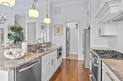 a kitchen with white cabinets and stainless steel appliances at Gulf Views, Large Private Pool, 30A, Two Kitchens in Seacrest