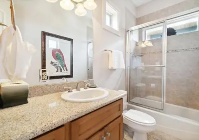 a bathroom with a sink and a shower and a toilet at Cozy Beach House (4 min walk) w/Pool + Fast WiFi in Panama City Beach