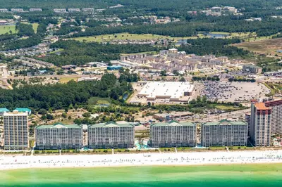 an aerial view of a resort with the beach and buildings at Long Beach Resort 3-404 in Panama City Beach