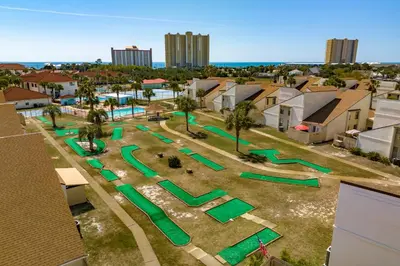an aerial view of a playground with green at Seaspray Hideaway Sleeps 8 Pools Beach Access in Panama City Beach