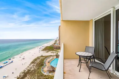 a balcony with a view of the beach at PCB Emerald beach retreat in Panama City Beach