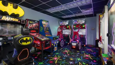 a room with arcade games and video game machines at 1BD/2BA Unit w/ a bunk alcove and amazing views right on the GULF! in Panama City Beach