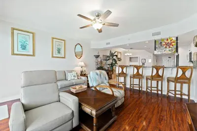 a living room with a couch and a table at Treasure Island #1502 in Panama City Beach