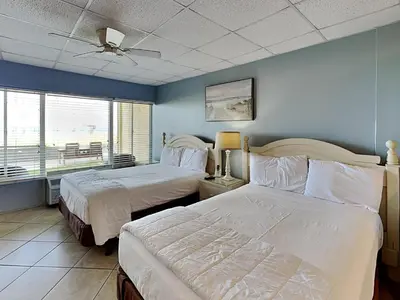 a bedroom with two beds and a ceiling fan at Continental 107 in Panama City Beach