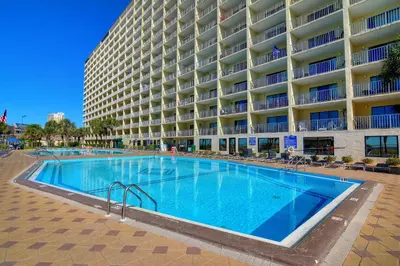 a large swimming pool in front of a large building at Summit Beach Resort #1102 in Panama City Beach
