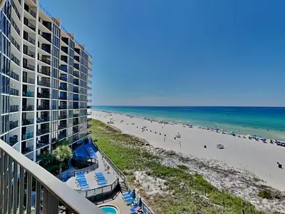 a view of the beach from the balcony of a resort at Edgewater Tower Ii 510 in Panama City Beach