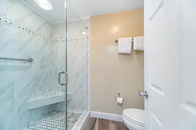 a bathroom with a shower and a toilet at Edgewater Villa #2112 in Panama City Beach