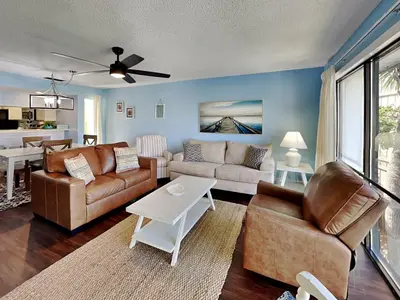 a living room with a couch and a table at Edgewater Villa #407 in Panama City Beach