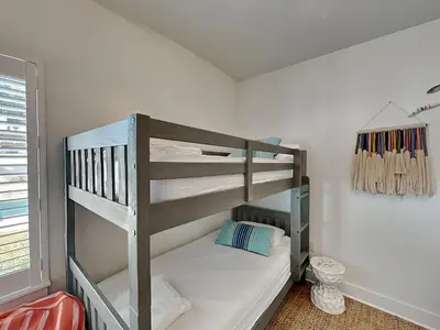 a bedroom with two bunk beds in a room at Sun Kissed Memories in Panama City Beach