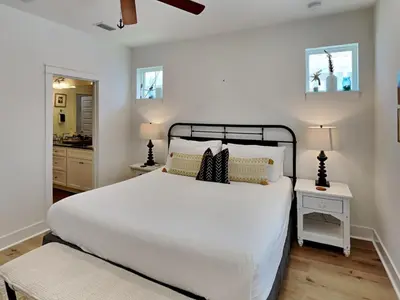 a bedroom with a large white bed and two lamps at Sun Kissed Memories in Panama City Beach