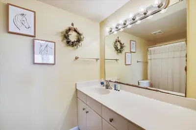 a bathroom with a sink and a mirror at Shores of Panama 328 - Low Floor HUGE 3 BedroomBunk Room, Reserved Parking, condo in Panama City Beach