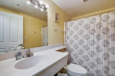 a bathroom with a sink and a toilet and a shower at Shores of Panama 328 - Low Floor HUGE 3 BedroomBunk Room, Reserved Parking, condo in Panama City Beach
