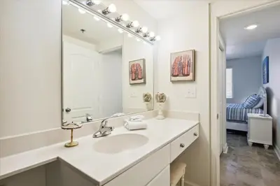a bathroom with a sink and a mirror at Shores of Panama 1717 - 1 Bedroom Bunk room Sleeps 6, Gulf-Front with Oversized Balcony! condo in Panama City Beach