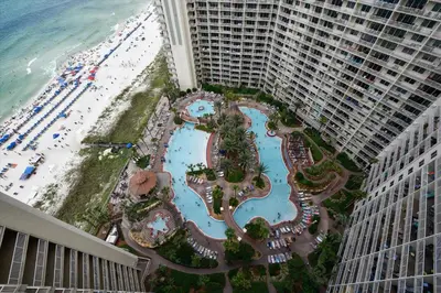 an aerial view of a resort with a beach and buildings at Shores of Panama 2026 - 1 BedroomBunksSleeps 6, Res, Parking! condo in Panama City Beach