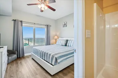 a bedroom with a bed and a window at Shores of Panama 2026 - 1 BedroomBunksSleeps 6, Res, Parking! condo in Panama City Beach