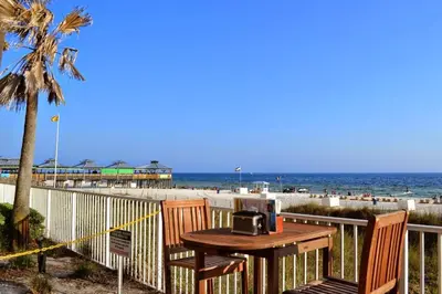 a table with a radio sitting on top of a beach at Shores of Panama 2026 - 1 BedroomBunksSleeps 6, Res, Parking! condo in Panama City Beach
