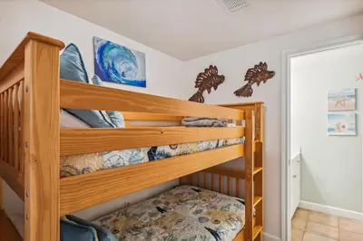 a bunk bed in a childs bedroom at Shores of Panama 1418 - 2 BedroomBunkroom Sleeps8! Updated with a View! Free Fun! condo in Panama City Beach
