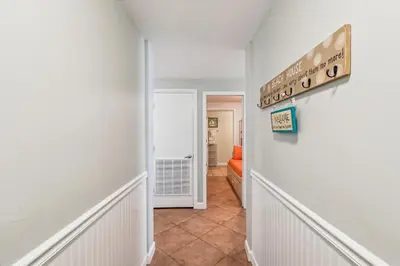 a hallway with a hallway leading into a room at Shores of Panama 521 - 2 Bedroom Bunks Sleeps 6, Reserved Parking! condo in Panama City Beach