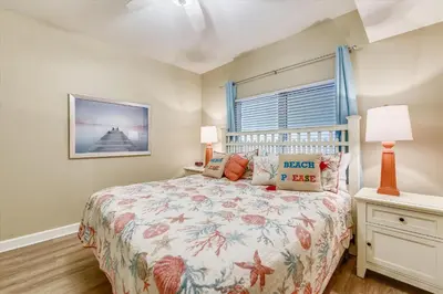 a bedroom with a bed and a window at Shores of Panama 808- 1 BedroomBunk Room, Free Fun! Updated! Sleeps 6, condo in Panama City Beach