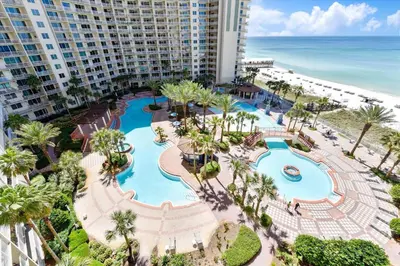 an aerial view of a resort with a pool and the ocean at Shores of Panama 808- 1 BedroomBunk Room, Free Fun! Updated! Sleeps 6, condo in Panama City Beach