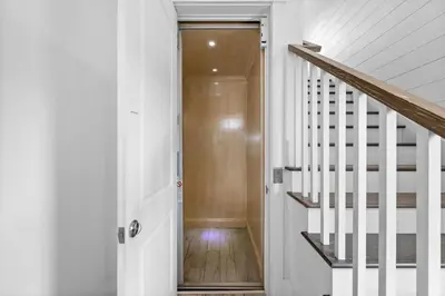 a hallway with a door and a stairway at Beach Gulf Views with a 3rd Floor Pool - Mala House - Inlet Beach, FL home in Inlet Beach