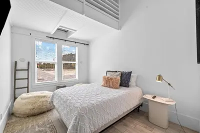 a white bedroom with a bed and a window at Beach Gulf Views with a 3rd Floor Pool - Mala House - Inlet Beach, FL home in Inlet Beach